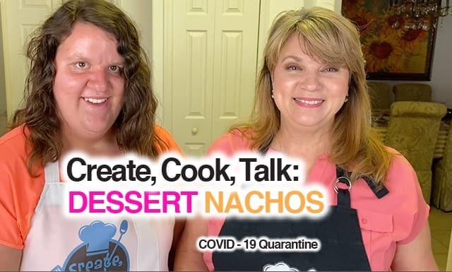 Two women smile in front of a kitchen counter, with text overlay "Create, Cook, Talk: DESSERT NACHOS COVID-19 Quarantine