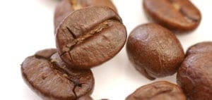 Several coffee beans with a white background.