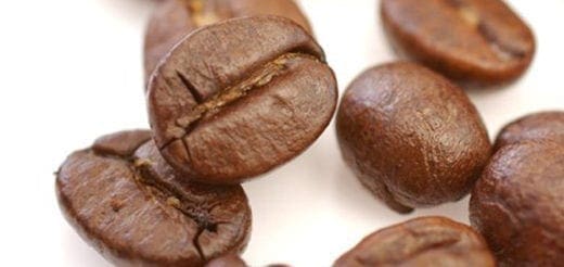 Several coffee beans with a white background.