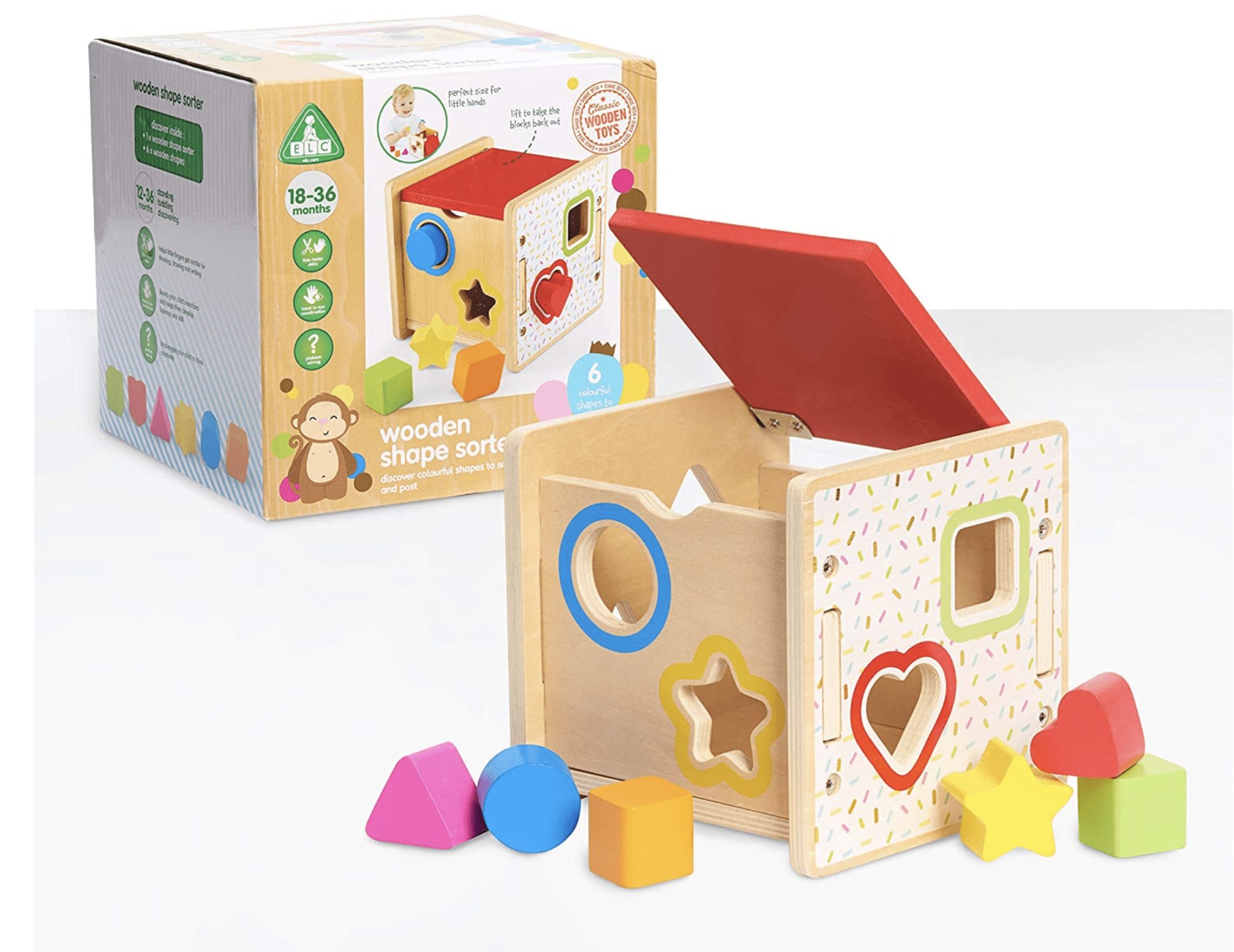 Wooden shape sorter cube with colorful blocks and the box in the background.