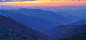 Rolling blue mountains at sunset