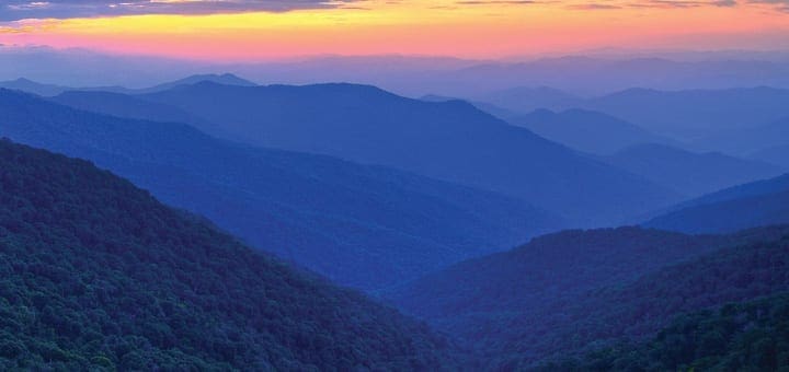 Rolling blue mountains at sunset