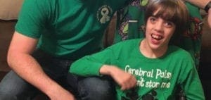 Bryant family members wear green shirts to promote cerebral palsy awareness.