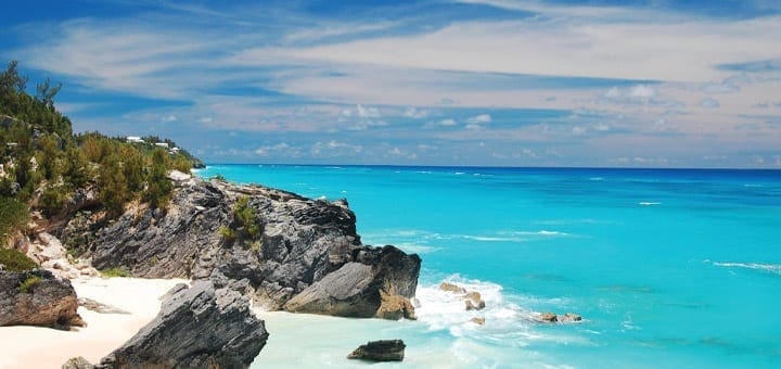 Rocky shore with turquoise water and blue sky