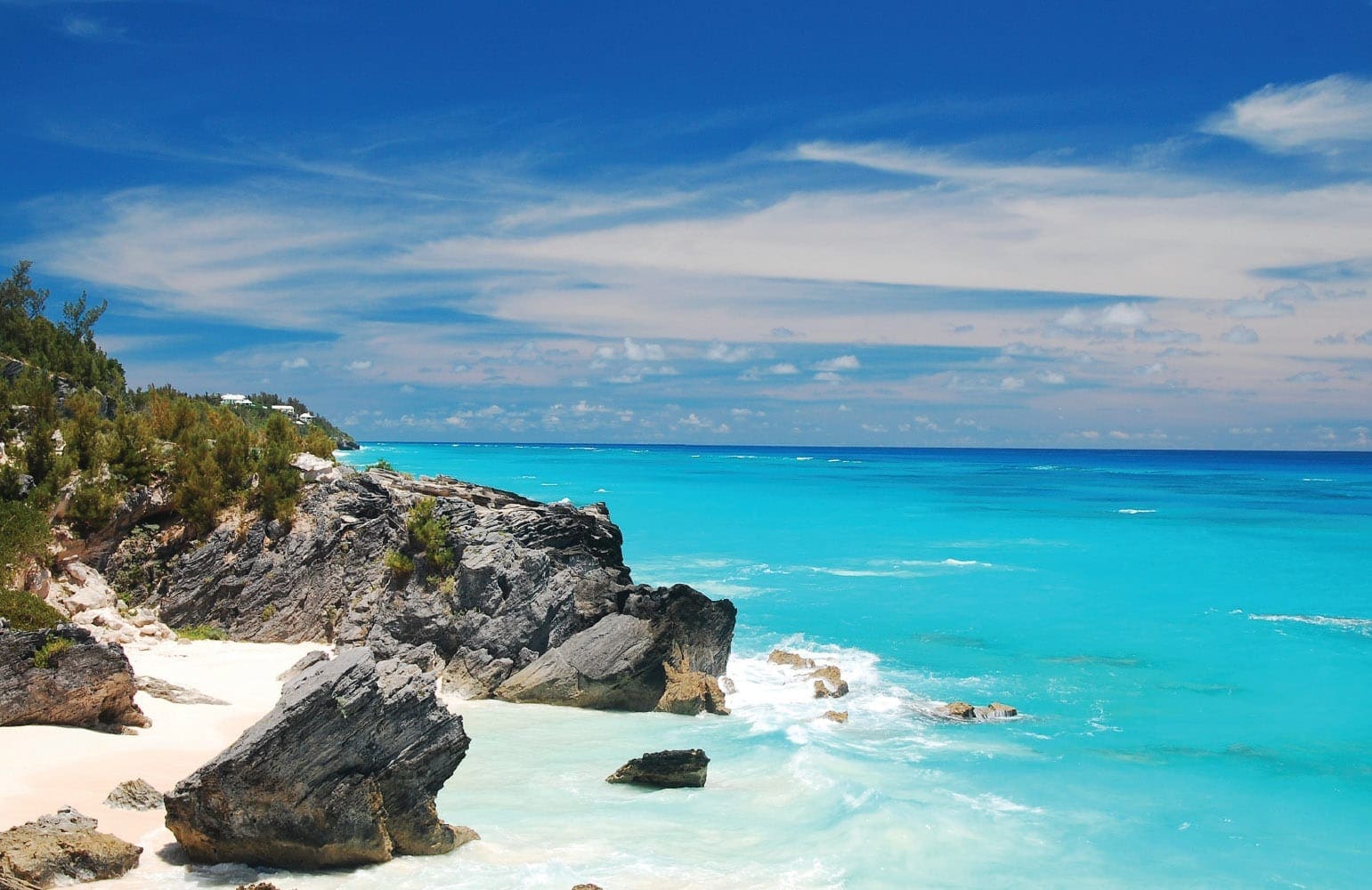 Rocky coastline and white sand beach on South Shore, Bermuda.