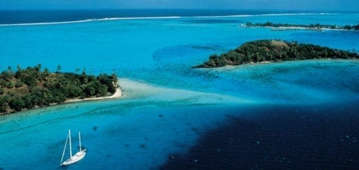 Sailboat in the turquoise waters off Bora Bora islands