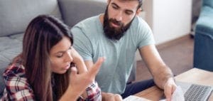 Couple reviewing finances at home