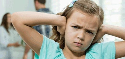 A child covers her ears with a distressed expression as two adults argue in the background.