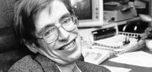 Stephen Hawking smiling in his office.