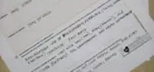 Close-up of a printed document with text and a small heart icon.