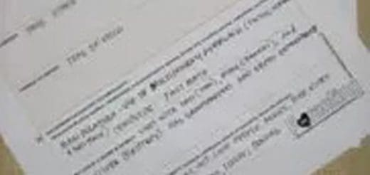 Close-up of a printed document with text and a small heart icon.