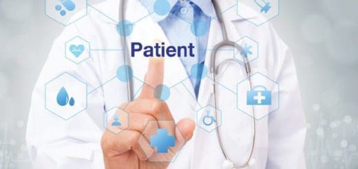 Doctor's hand touching the word "Patient" on a screen surrounded by medical icons.