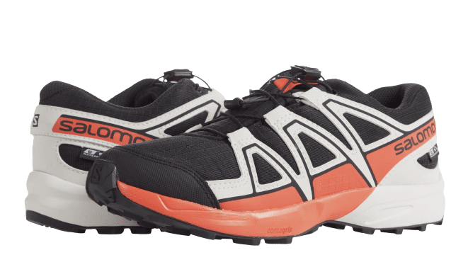 Salomon Kids trail running shoes with orange and white accents on a white background.