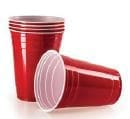 Stack of red plastic cups and one cup lying on its side