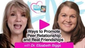 Dr. Elizabeth Biggs and another woman smile.