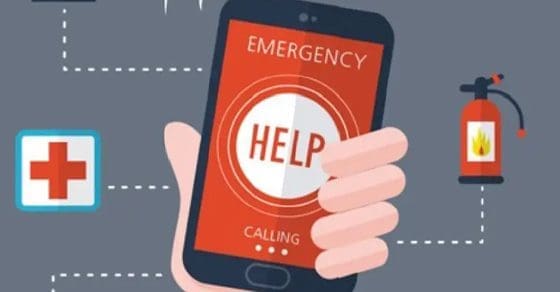 Hand holding a smartphone with "EMERGENCY HELP CALLING" displayed on the screen.