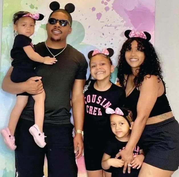 Indigo Abell and her family wearing mouse ears.