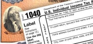 U.S. Individual Income Tax Form 1040 with a portrait of Alexander Hamilton.