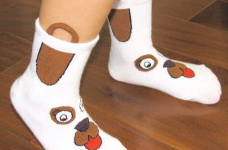 White socks with a dog face design.