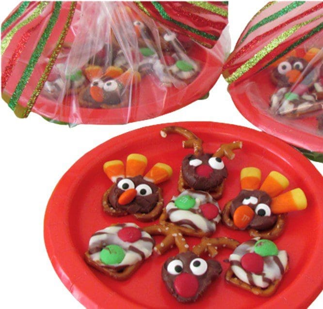 Festive pretzel treats decorated as turkeys and reindeer on a red plate.