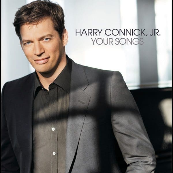 Harry Connick Jr. wearing a suit jacket and black shirt.
