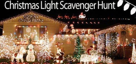 A house decorated with numerous Christmas lights, including snowmen and reindeer figures.