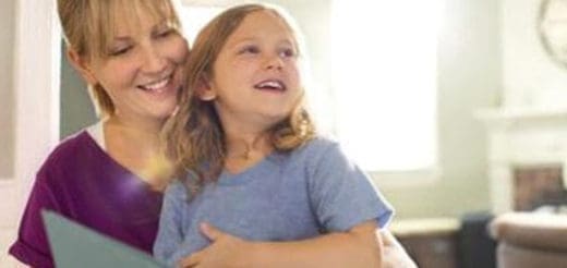 Woman reading a book with a child.