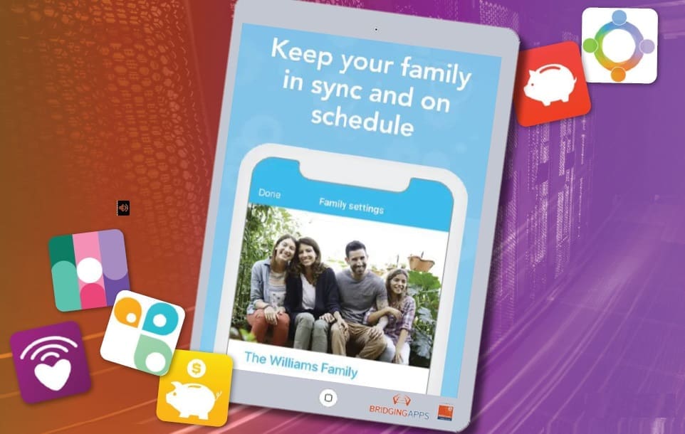 Tablet displaying a family calendar app with the text "Keep your family in sync and on schedule.