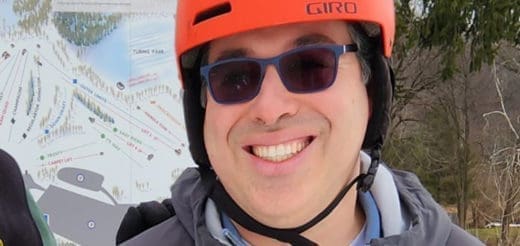 Dr. Christopher Najarian smiling in an orange helmet and sunglasses.