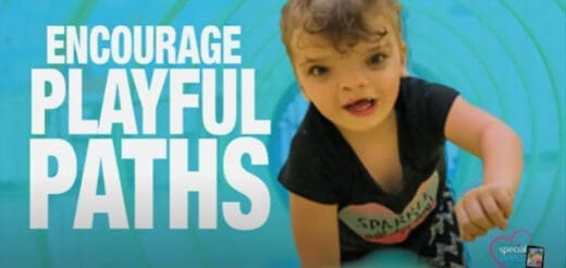 A toddler crawls towards the camera with text that reads "ENCOURAGE PLAYFUL PATHS" on the left.