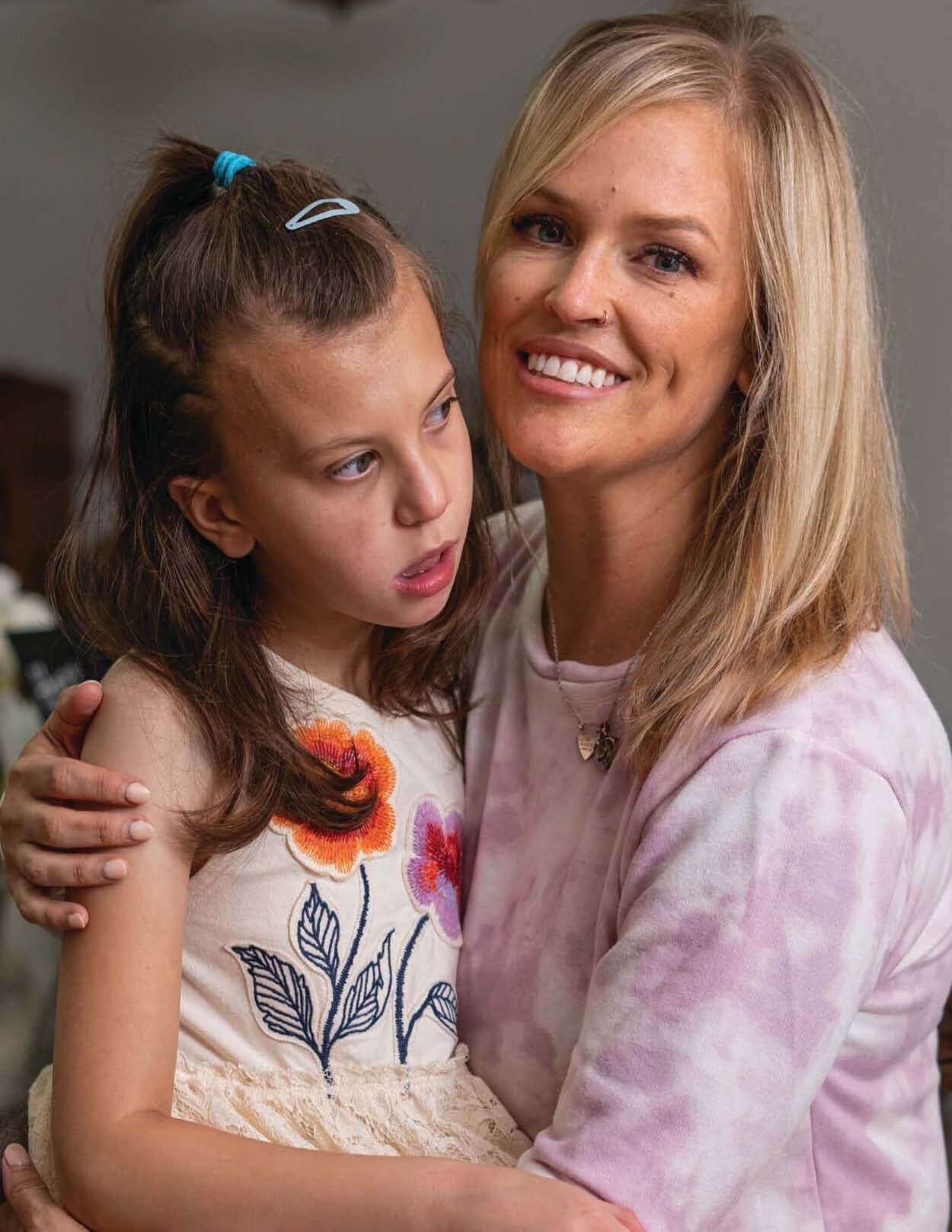 Bethany Riddlehoover holds her daughter Aurora Riddlehoover.