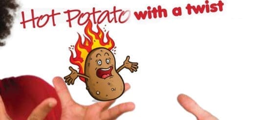 A cartoon potato with arms and legs is on fire, with a surprised expression, held between two hands.