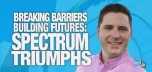 A man smiles in front of text that reads "Breaking Barriers Building Futures: Spectrum Triumphs.