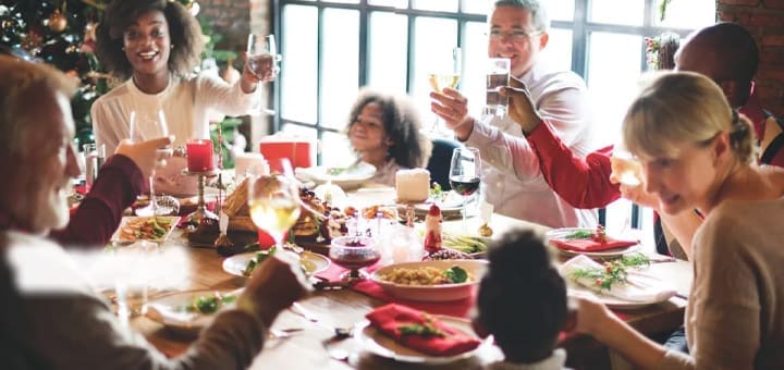 Family celebrating around a holiday dinner table