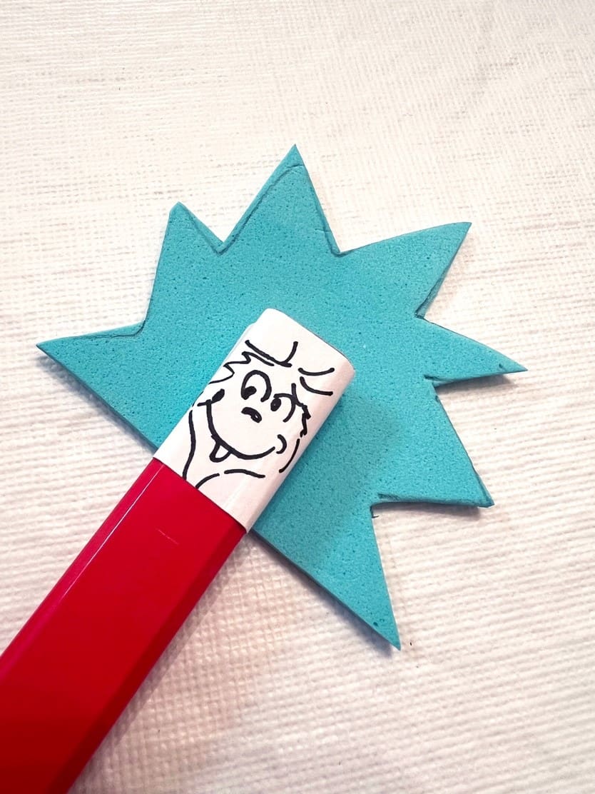 Thing 1 and Thing 2 pencil toppers with blue spiky hair and drawn faces.
