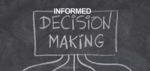 Text on a chalkboard reads "INFORMED DECISION MAKING.
