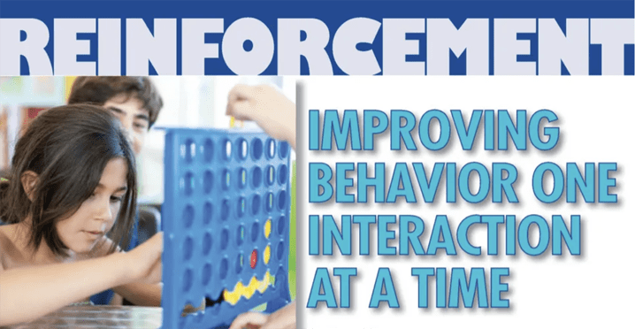 Children playing a Connect Four game.