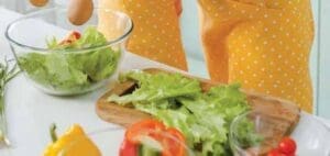 Fresh lettuce and vegetables on a counter for making a salad.