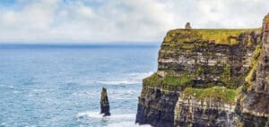 The Cliffs of Moher in Ireland with the ocean in the background.