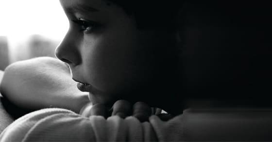 Profile of a young child looking away from the camera.