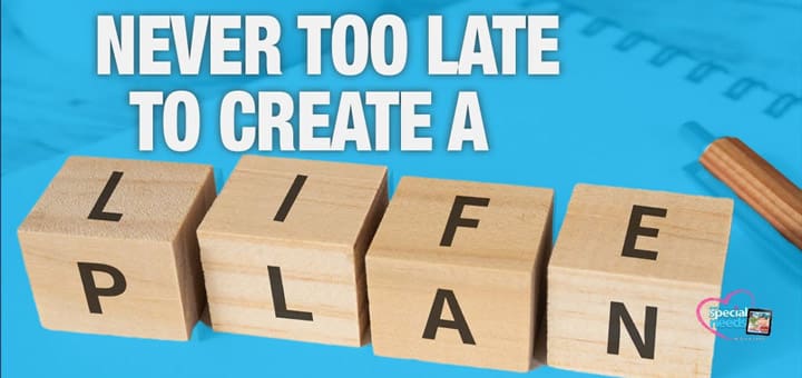 Four wooden blocks spell "LIFE PLAN" with the text "NEVER TOO LATE TO CREATE A" above.