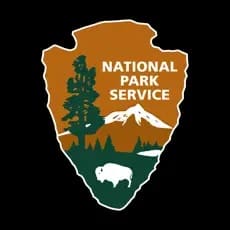 National Park Service logo with a bison, trees, and mountains