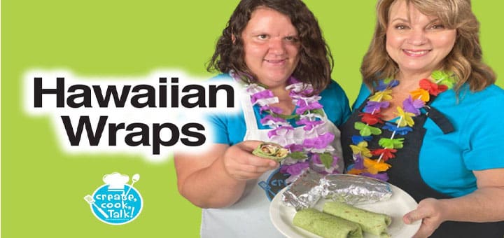 Two women holding Hawaiian wraps.