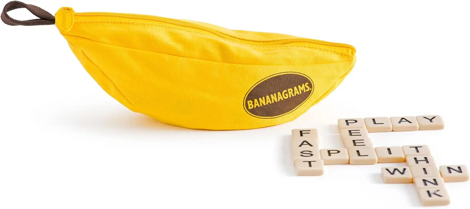 Bananagrams word game tiles scattered next to a yellow banana-shaped pouch.