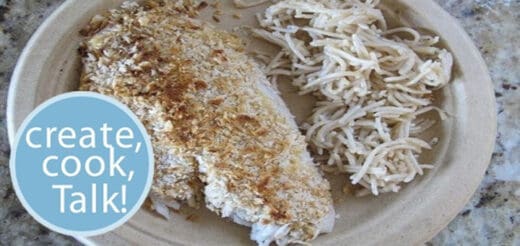 Panko crusted fish with shredded vegetables on a plate.