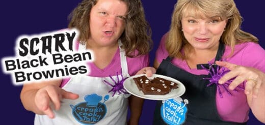 Two women hold a plate of brownies with a "Scary Black Bean Brownies" graphic.