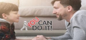 Father and son looking at each other with the text "YOU CAN DO IT!