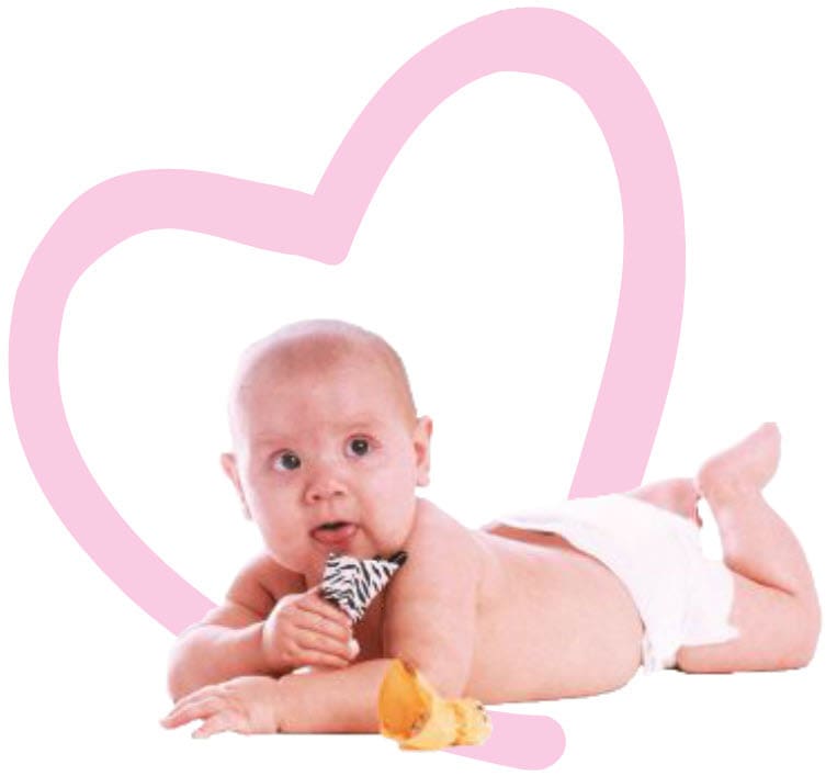 Kailee, 18 years ago, lying on her stomach with a pink heart behind her.
