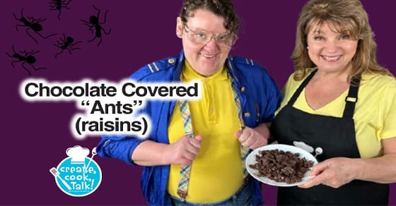 Two people hold a plate of chocolate-covered raisins with text overlaying "Chocolate Covered Ants (raisins)".