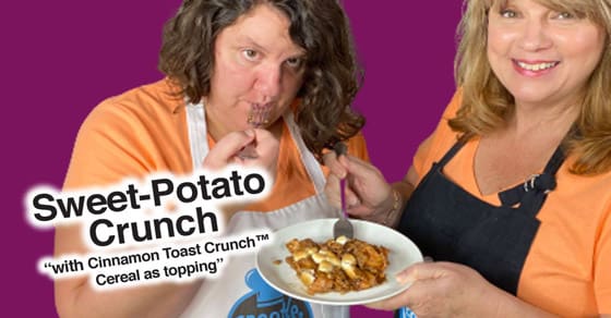 Two women present a plate of sweet potato crunch with Cinnamon Toast Crunch cereal as a topping.